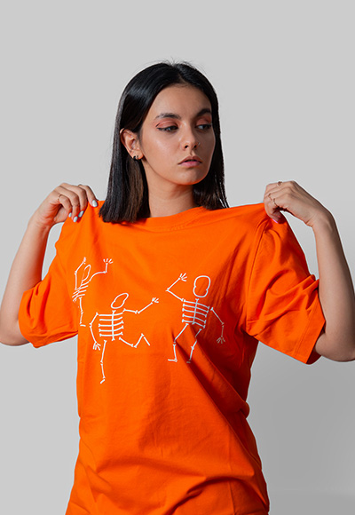 تیشرت-نارنجی-دخترانه-یونیسکس-مدل-skull